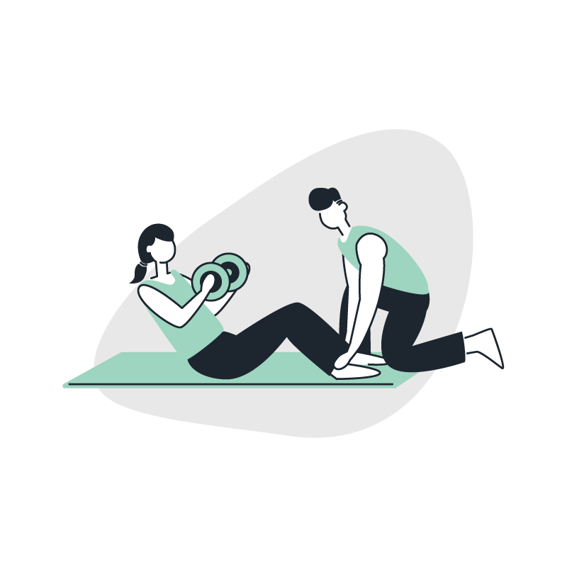 A trainer helping a client do situps